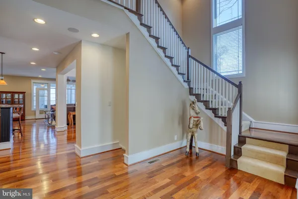 a view of a dining room with furniture wooden floor and chandelier