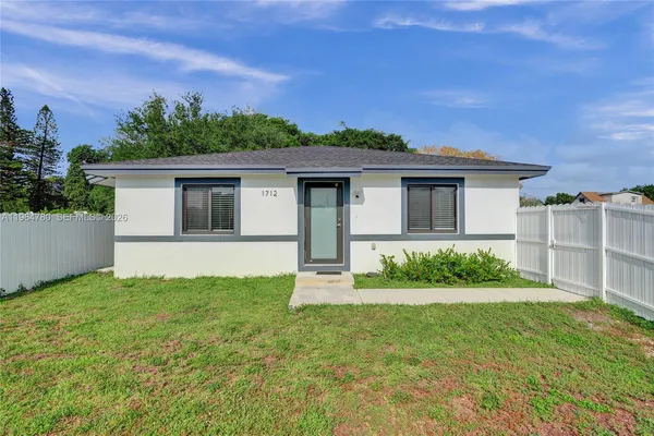 a house with trees in the background