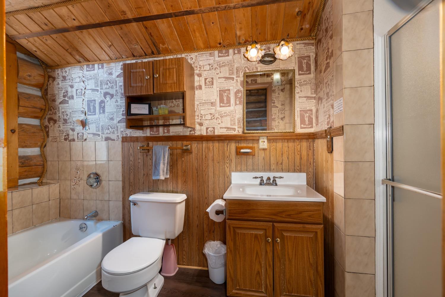 7426 Henness Ridge Road Yosemite West, CA 95389 - Photo 31 of 35 Main floor bathroom includes tub and separate shower.