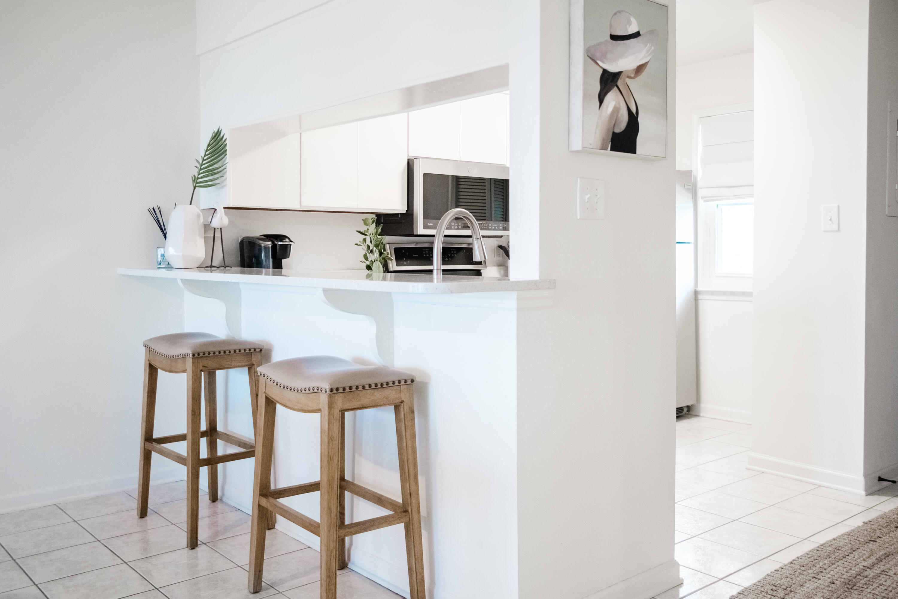 23011 Front Beach Road, Unit 58 Panama City Beach, FL 32413 - Photo 14 of 32 a view of kitchen with furniture and microwave
