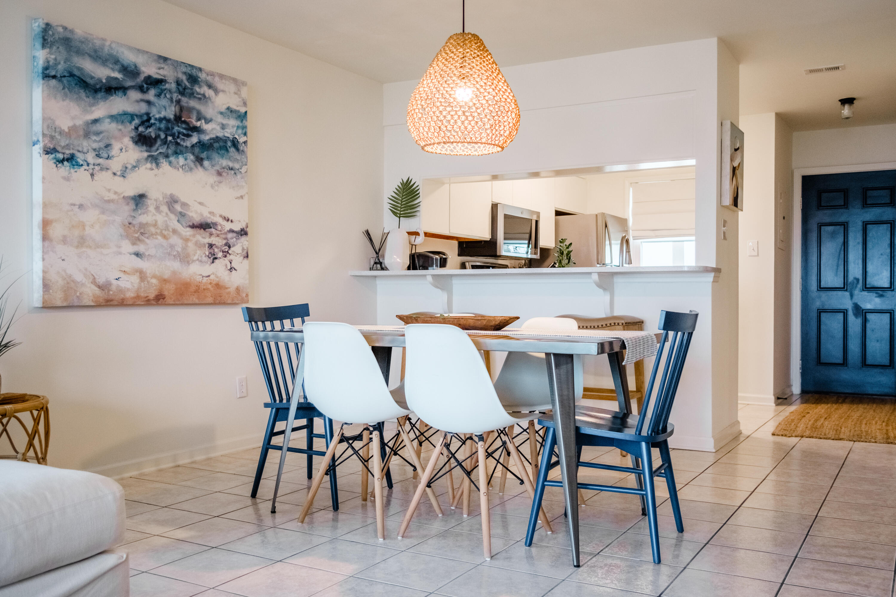 23011 Front Beach Road, Unit 58 Panama City Beach, FL 32413 - Photo 16 of 32 a dining room with furniture and window