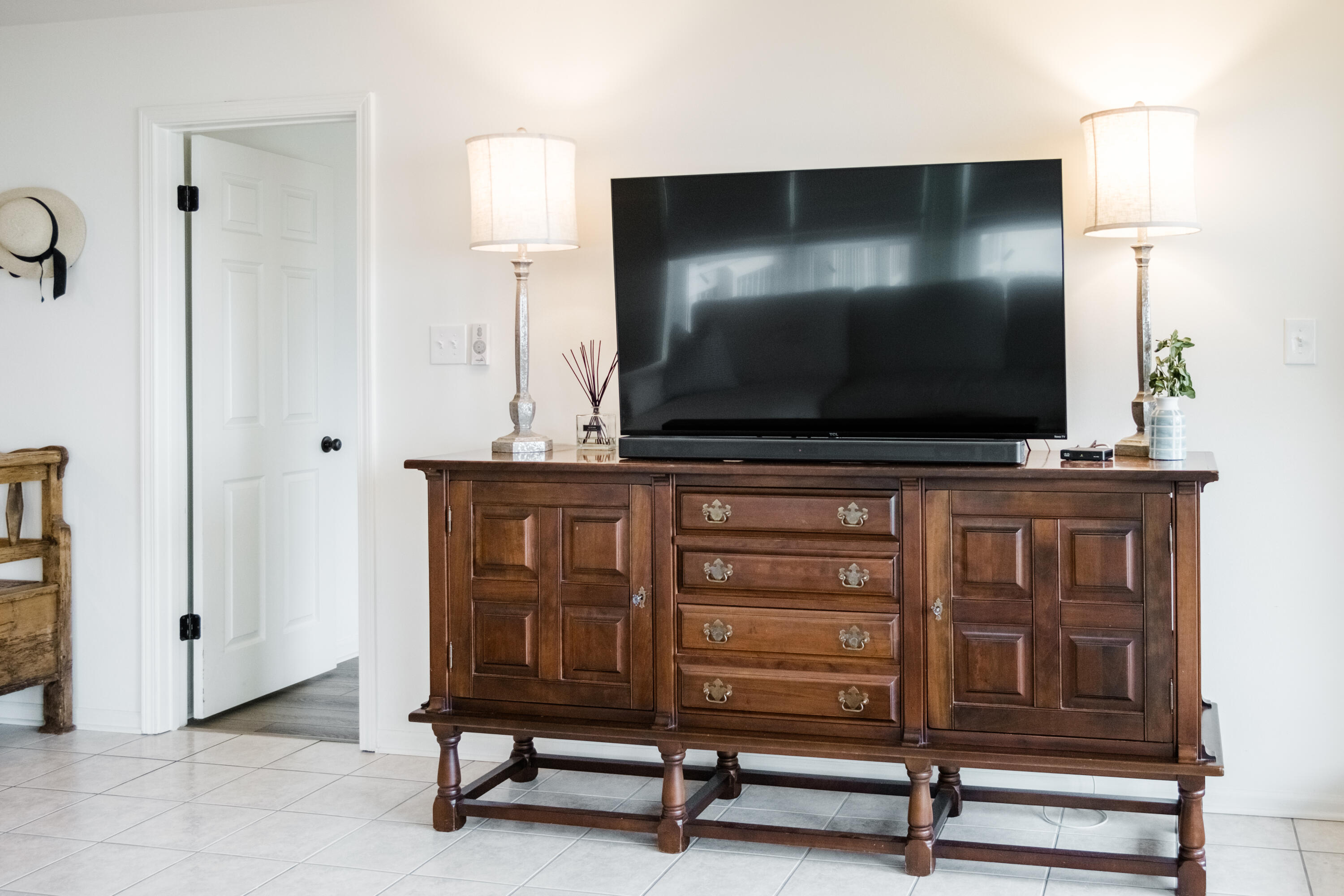 23011 Front Beach Road, Unit 58 Panama City Beach, FL 32413 - Photo 19 of 32 a living room with furniture and a flat screen tv