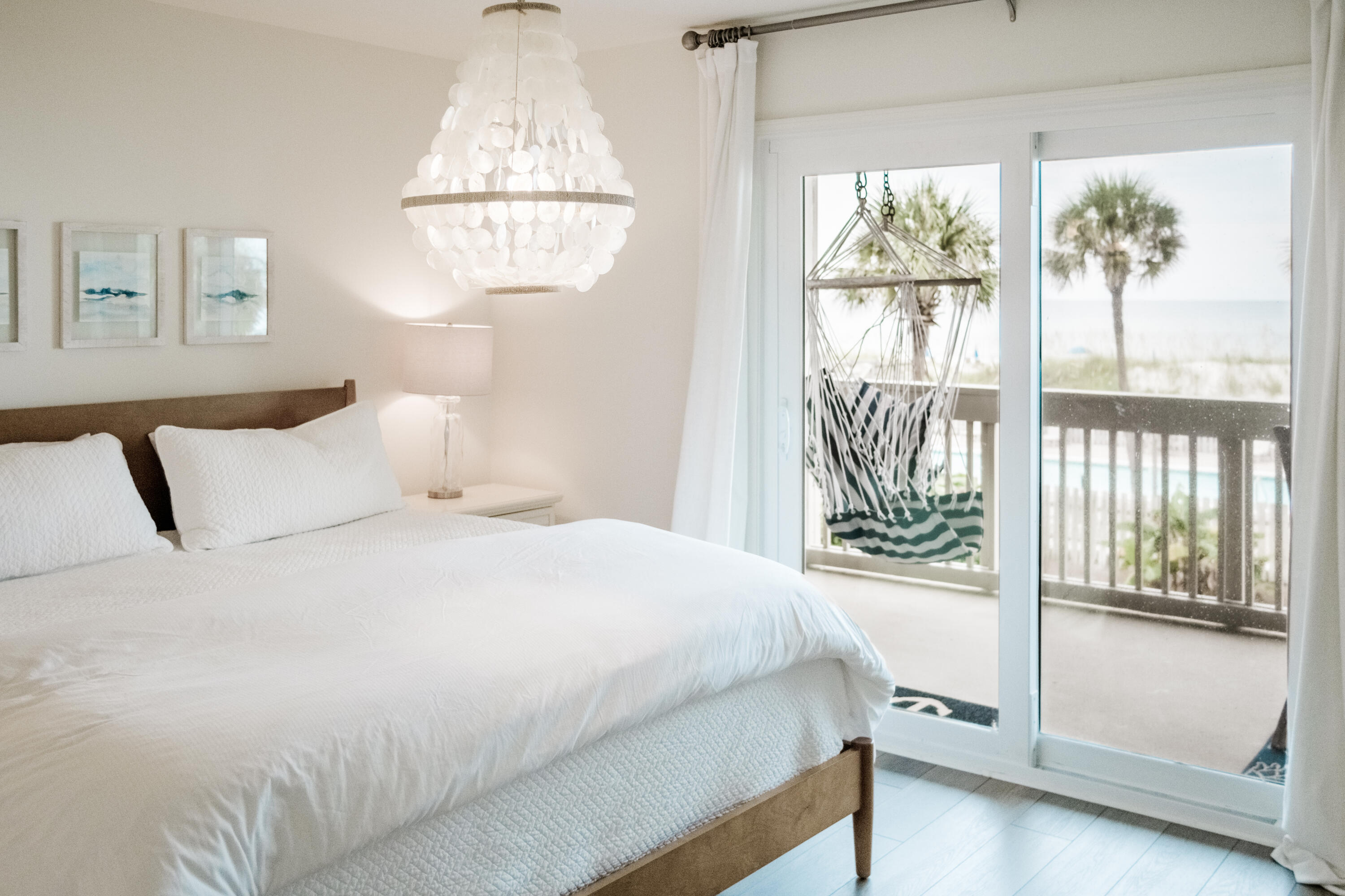 23011 Front Beach Road, Unit 58 Panama City Beach, FL 32413 - Photo 21 of 32 a bedroom with a bed and a window