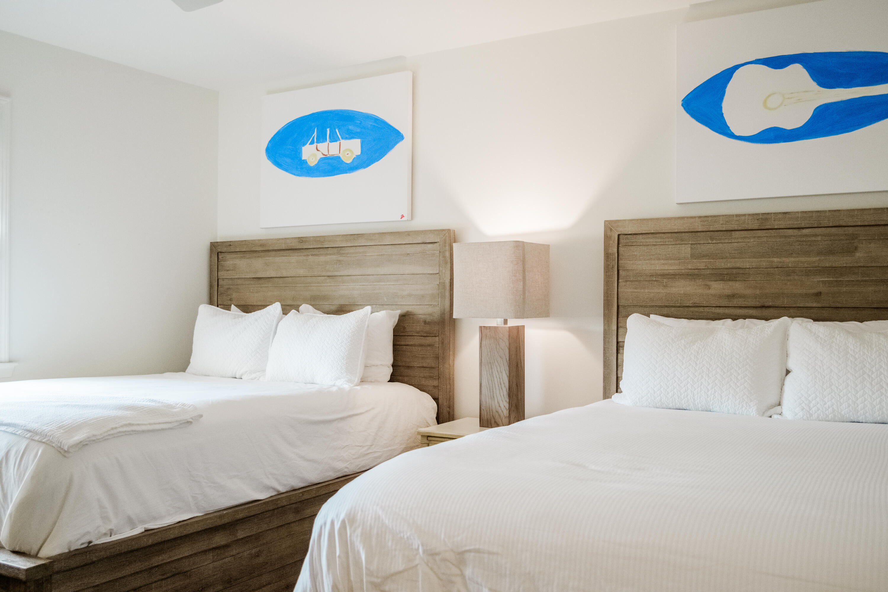 23011 Front Beach Road, Unit 58 Panama City Beach, FL 32413 - Photo 24 of 32 a bedroom with two beds and a painting on the wall