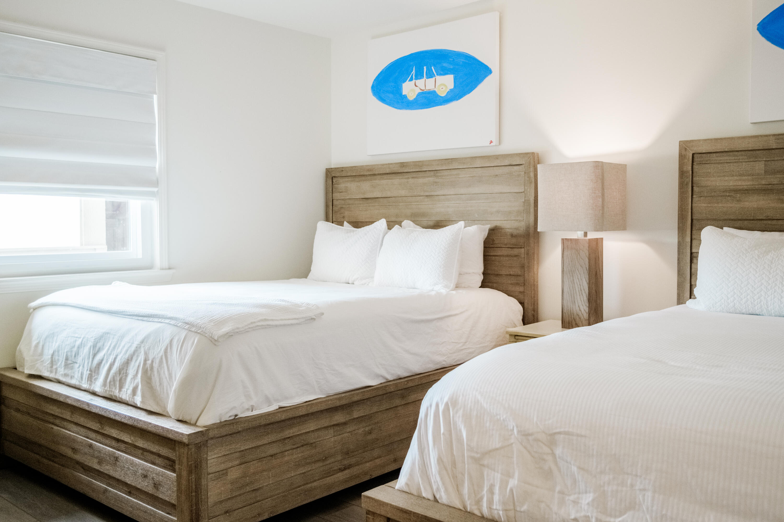 23011 Front Beach Road, Unit 58 Panama City Beach, FL 32413 - Photo 25 of 32 a bedroom with a bed and a wall painting