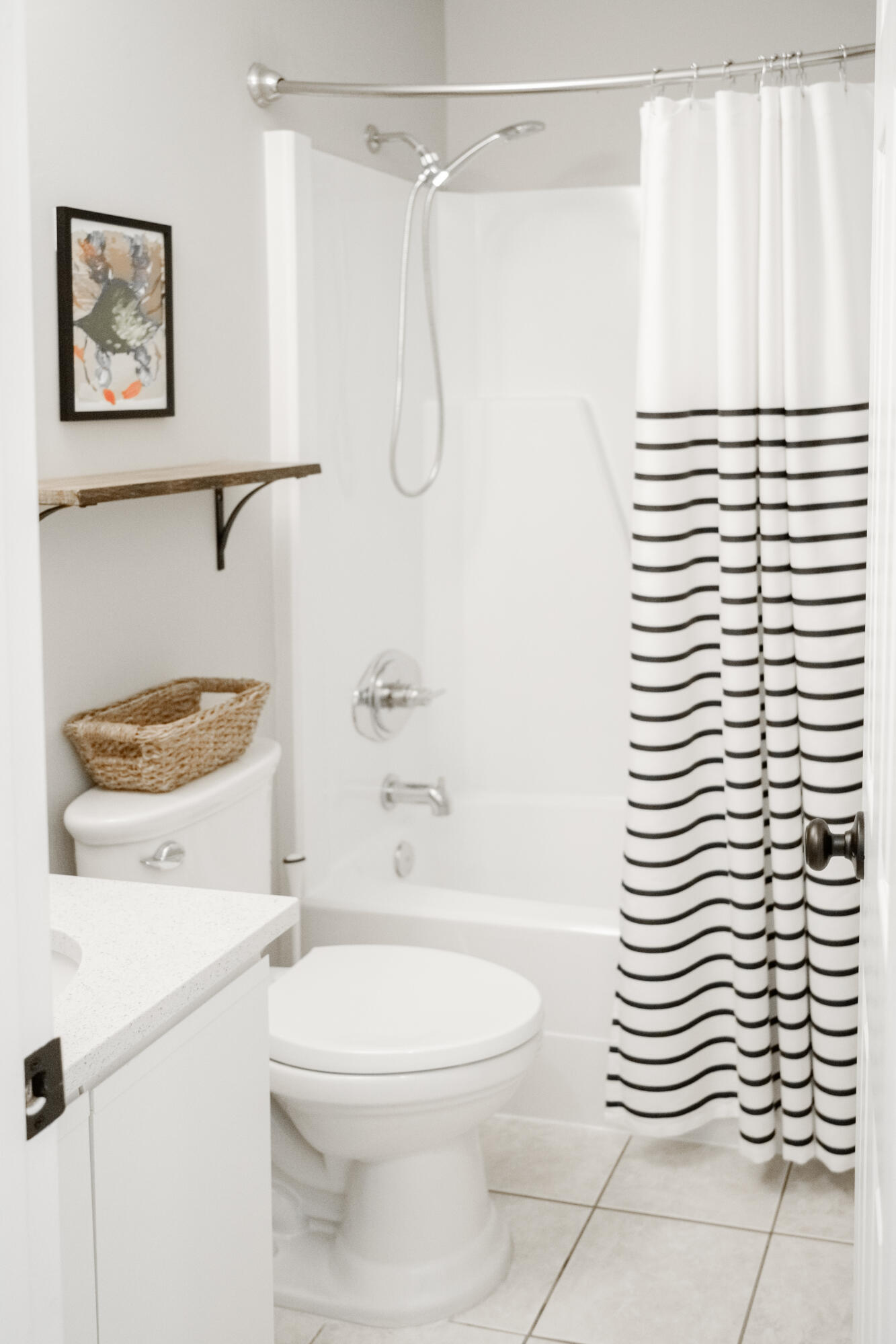 23011 Front Beach Road, Unit 58 Panama City Beach, FL 32413 - Photo 26 of 32 a bathroom with a sink a toilet and shower curtain