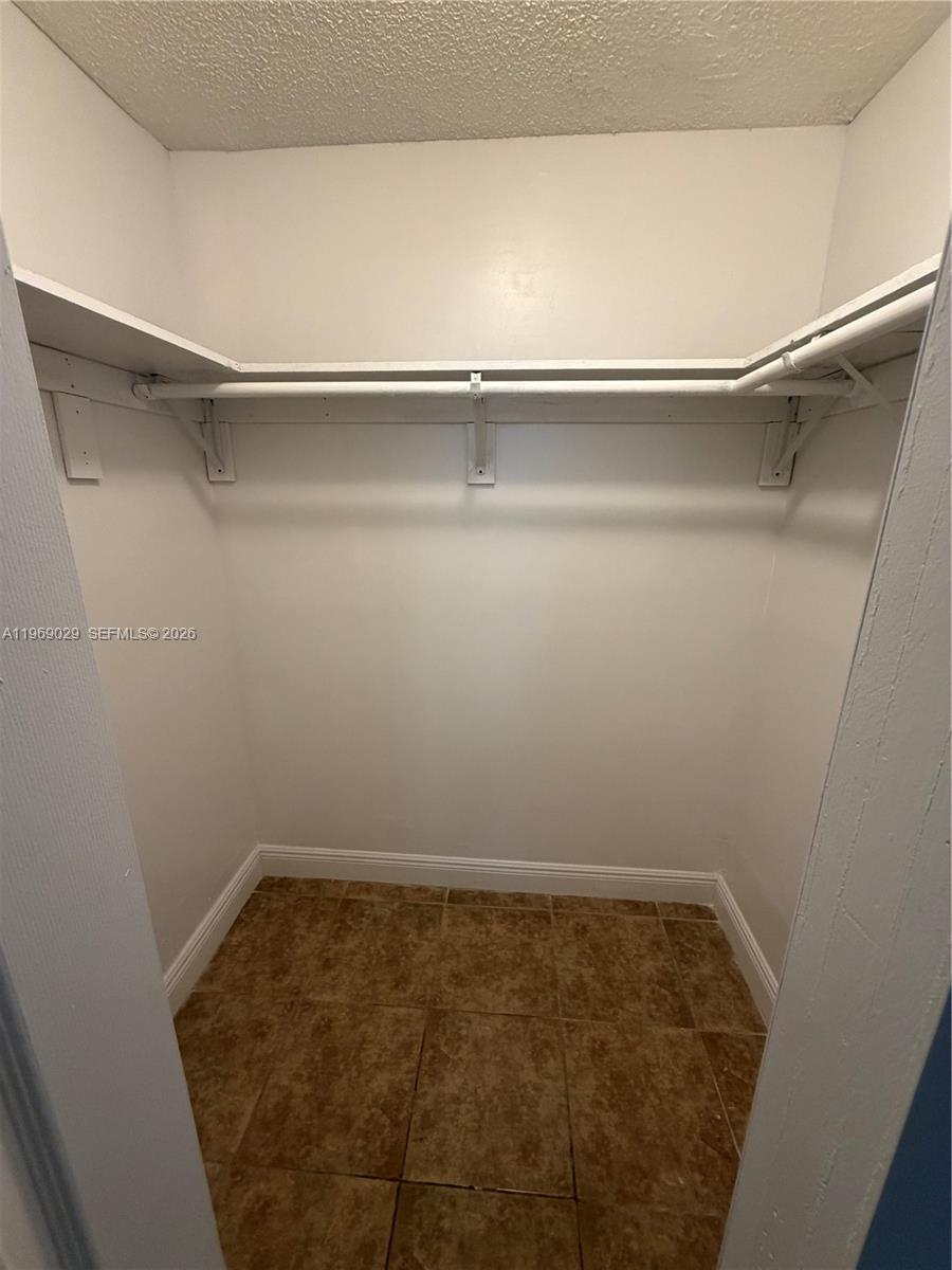 356 Southwest 2nd Place Pompano Beach, FL 33060 - Photo 13 of 23 a view of a room with shelf