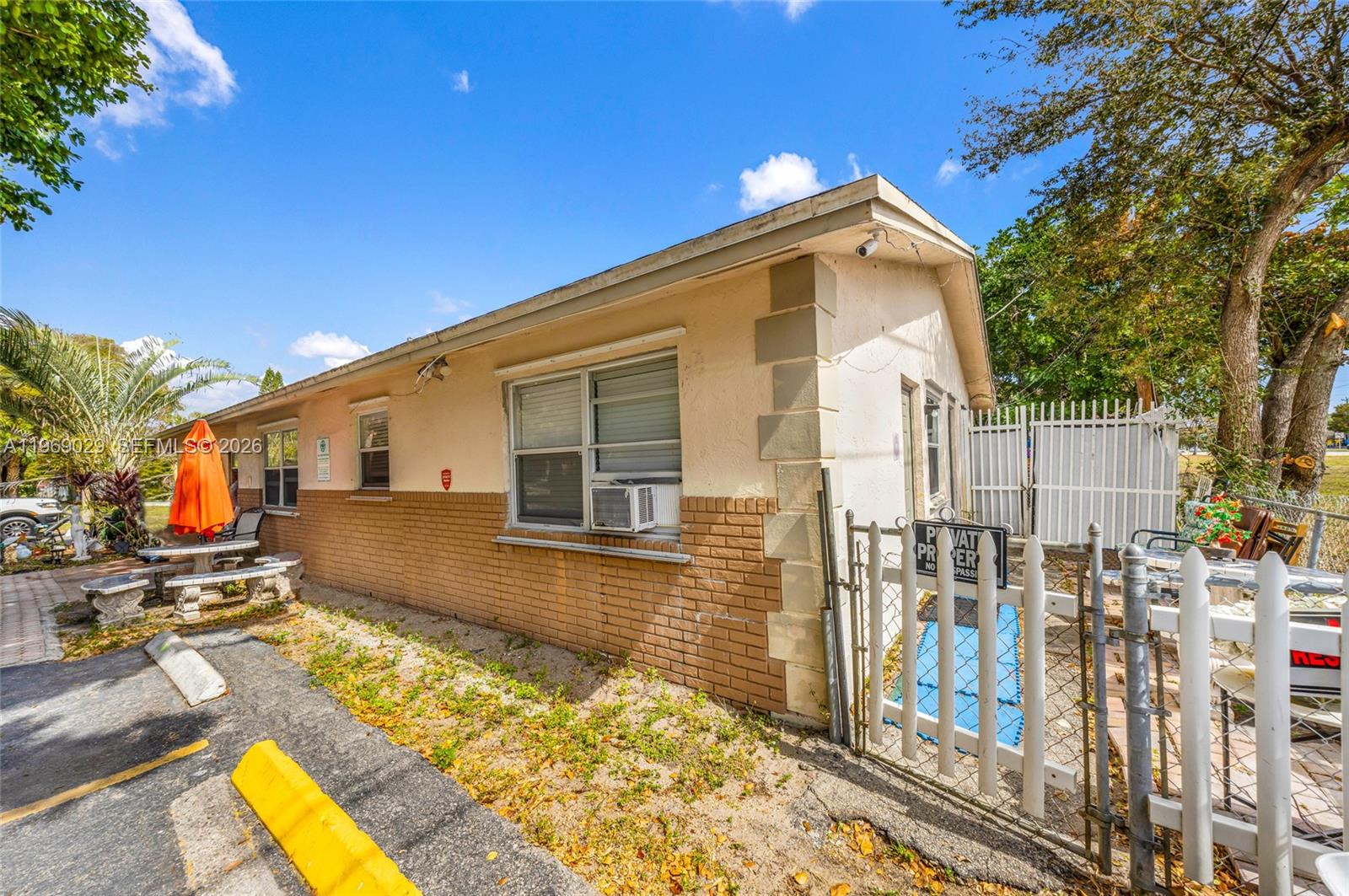 356 Southwest 2nd Place Pompano Beach, FL 33060 - Photo 20 of 23 a view of a house with a swimming pool