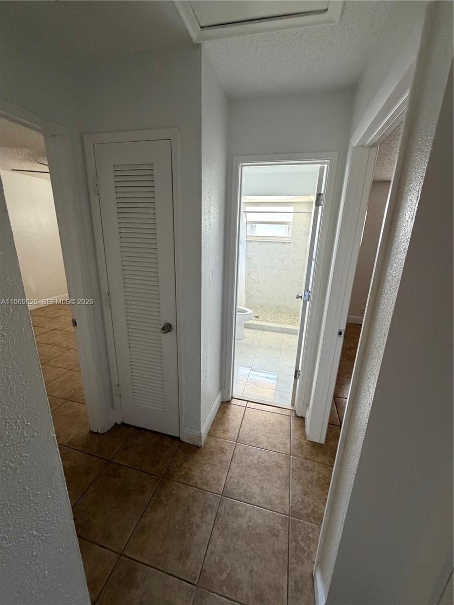 356 Southwest 2nd Place Pompano Beach, FL 33060 - Photo 10 of 23 a view of a hallway in a house