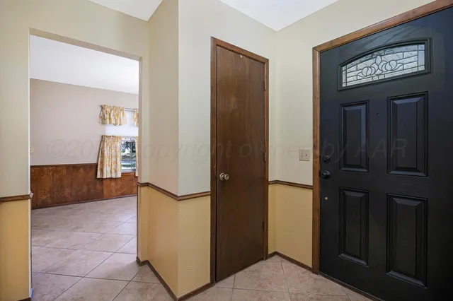 a view of a hallway to rooms and a kitchen