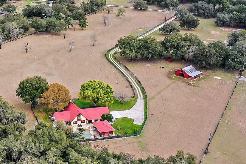 Aerial of Home, Pool, 6 Stall Barn, Tack Room and Hay Loft on 9 Acres