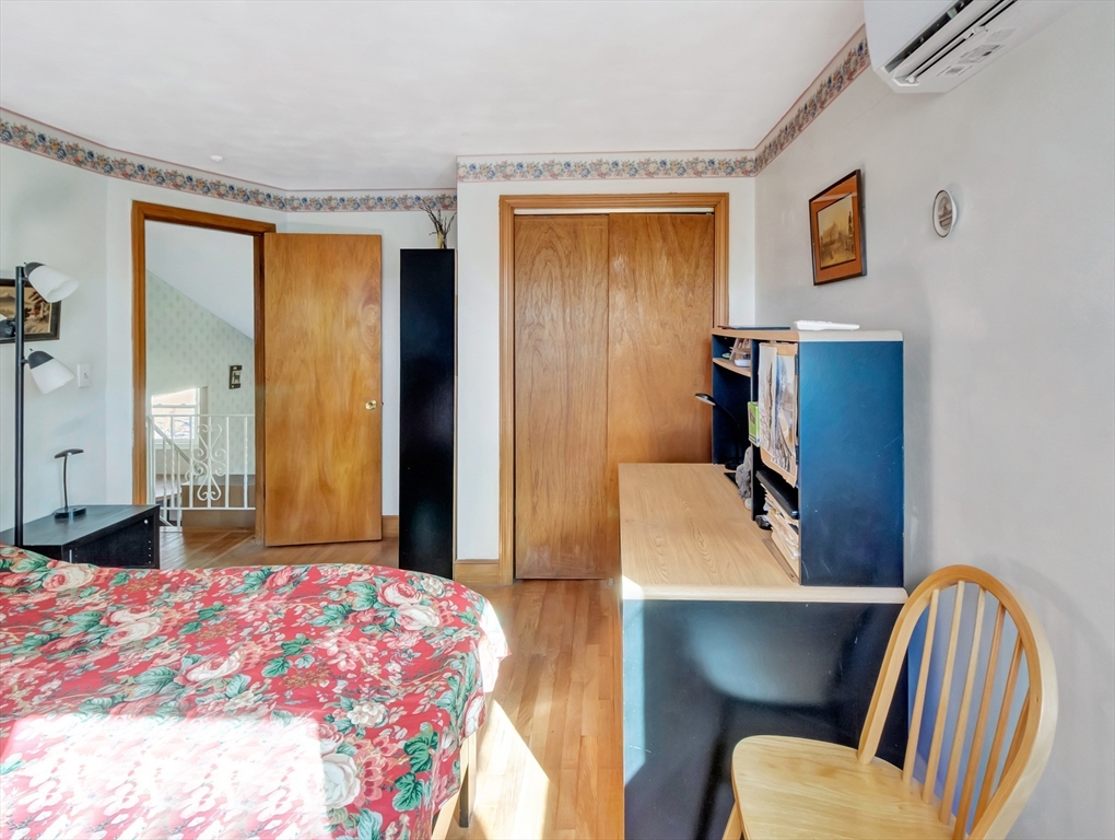 9 Madison Avenue Randolph, MA 02368 - Photo 19 of 30 a bedroom with a bed and wooden floor