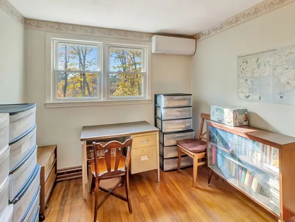 a view of a livingroom with furniture and a window