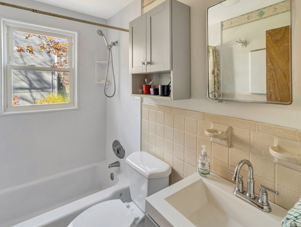 9 Madison Avenue Randolph, MA 02368 - Photo 24 of 30 a bathroom with a sink a toilet and bathtub