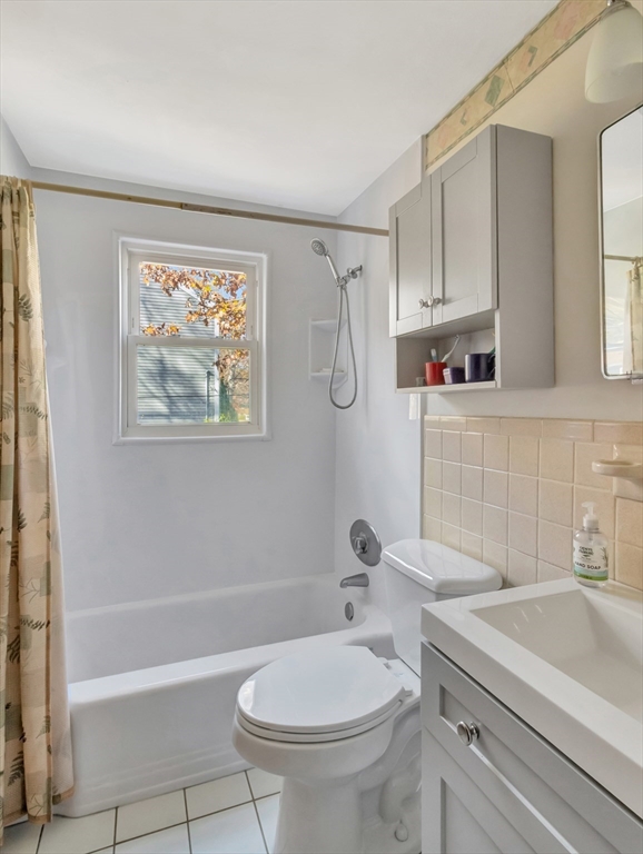 9 Madison Avenue Randolph, MA 02368 - Photo 25 of 30 a bathroom with a sink a toilet and shower