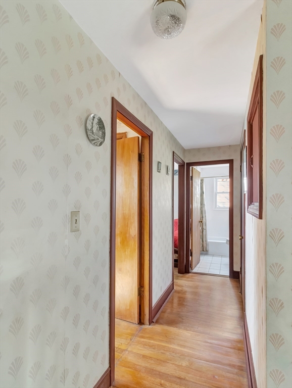9 Madison Avenue Randolph, MA 02368 - Photo 26 of 30 a view of a hallway with wooden shelves
