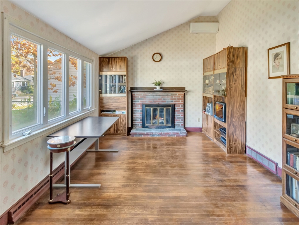 9 Madison Avenue Randolph, MA 02368 - Photo 7 of 30 a living room with furniture a fireplace and a large window