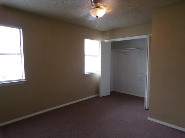 an empty room with a empty space and a window