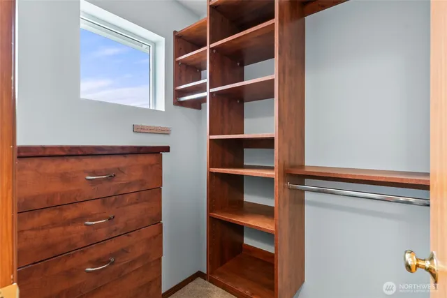 a view of an empty walk in closet