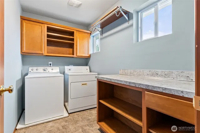 a utility room with dryer and washer