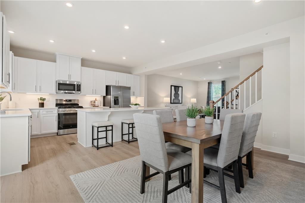 223 Elk Rdg Drive Moon Township, PA 15108 - Photo 5 of 17 a dining room with kitchen island furniture a dining table and chairs