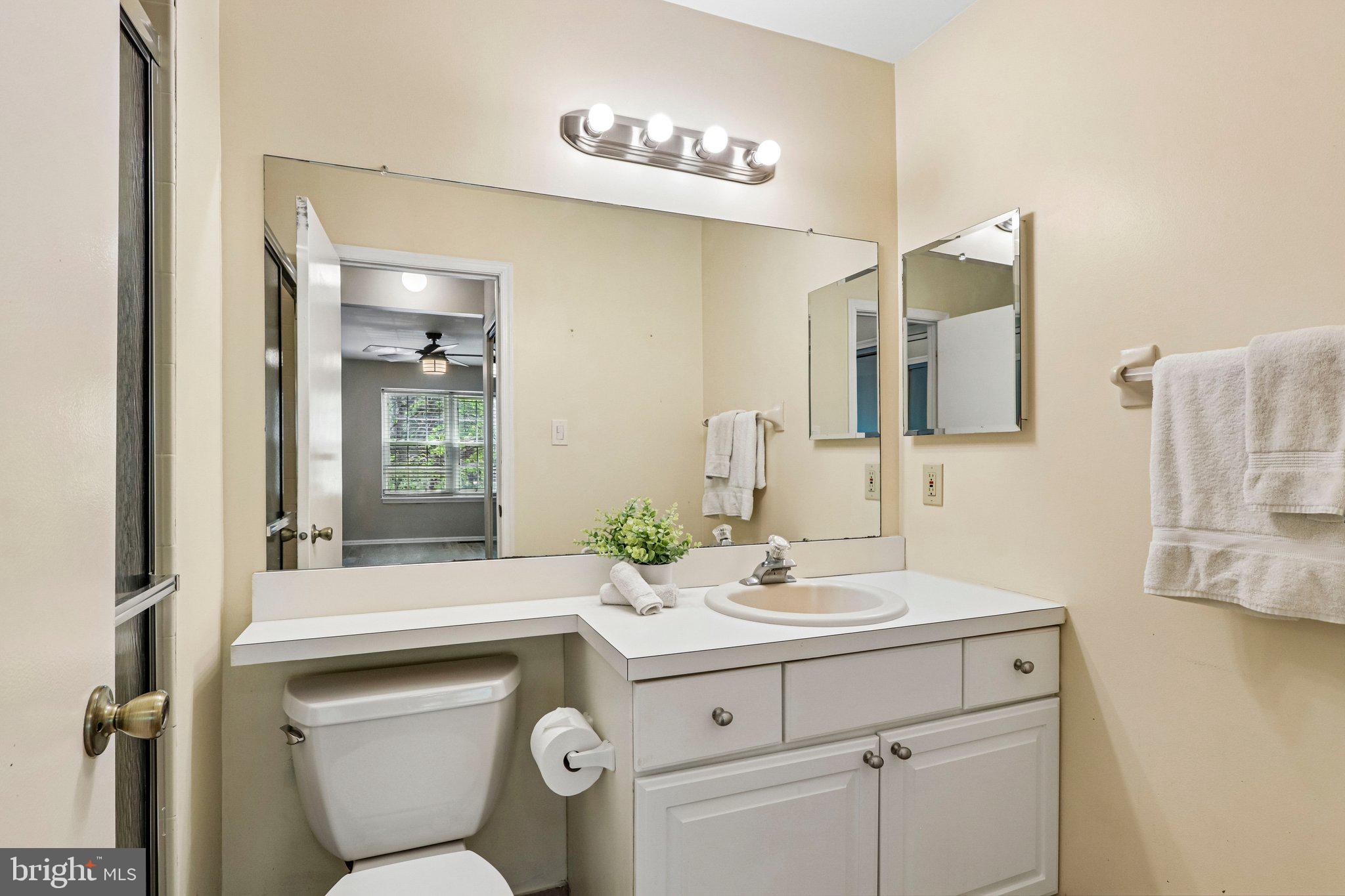 803 Wharton Road Mount Laurel, NJ 08054 - Photo 27 of 48 a bathroom with a toilet sink and mirror