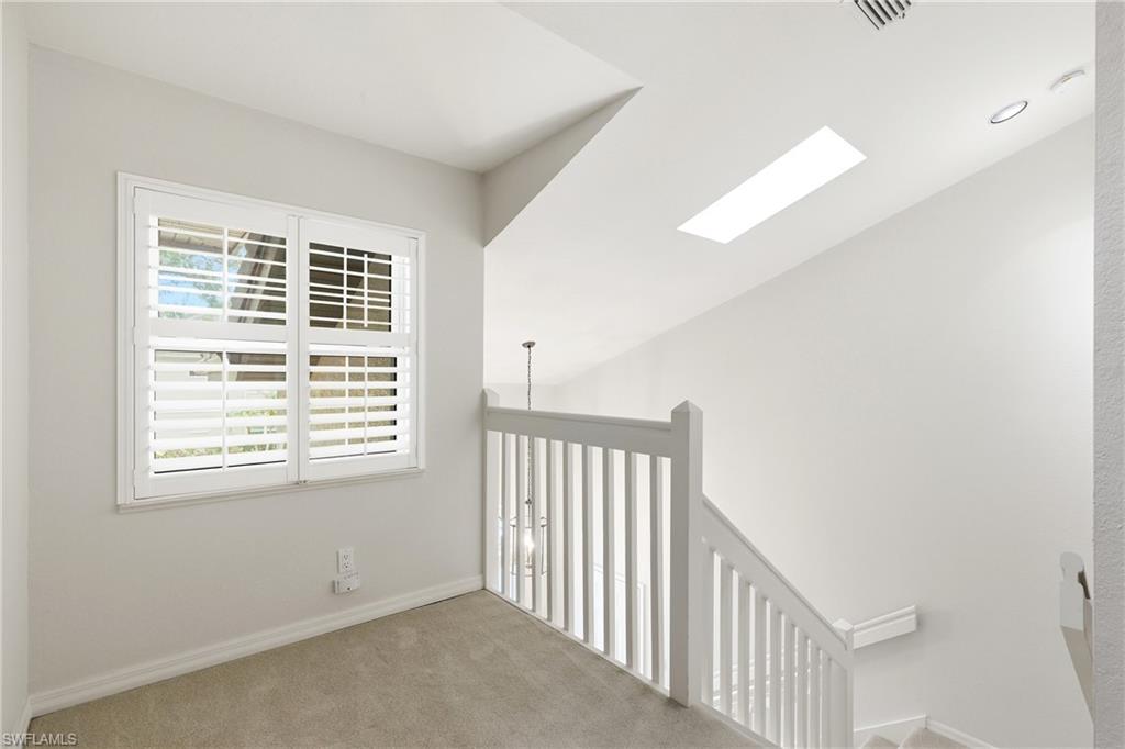203 Via Perignon, Unit 24 Naples, FL 34119 - Photo 11 of 42 Quiet sitting area top of stairs.