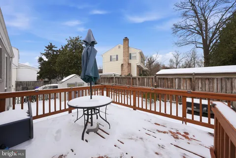 a view of a chair and tables in the balcony