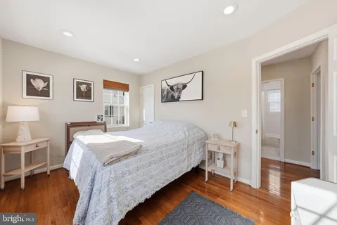 a bedroom with a bed and a table in it