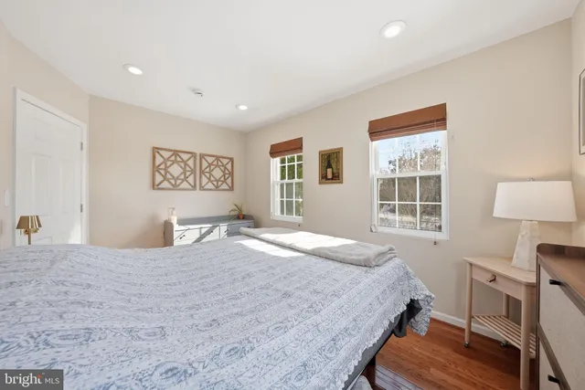 a bedroom with a bed and a desk