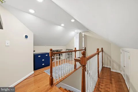 a view of a hallway with stairs