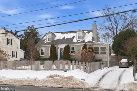 a view of a house with a snow in the yard