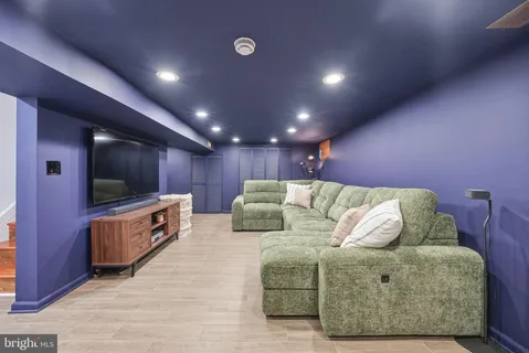 a bed room with a bed and a television