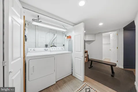 a bathroom with a sink a mirror and a shower