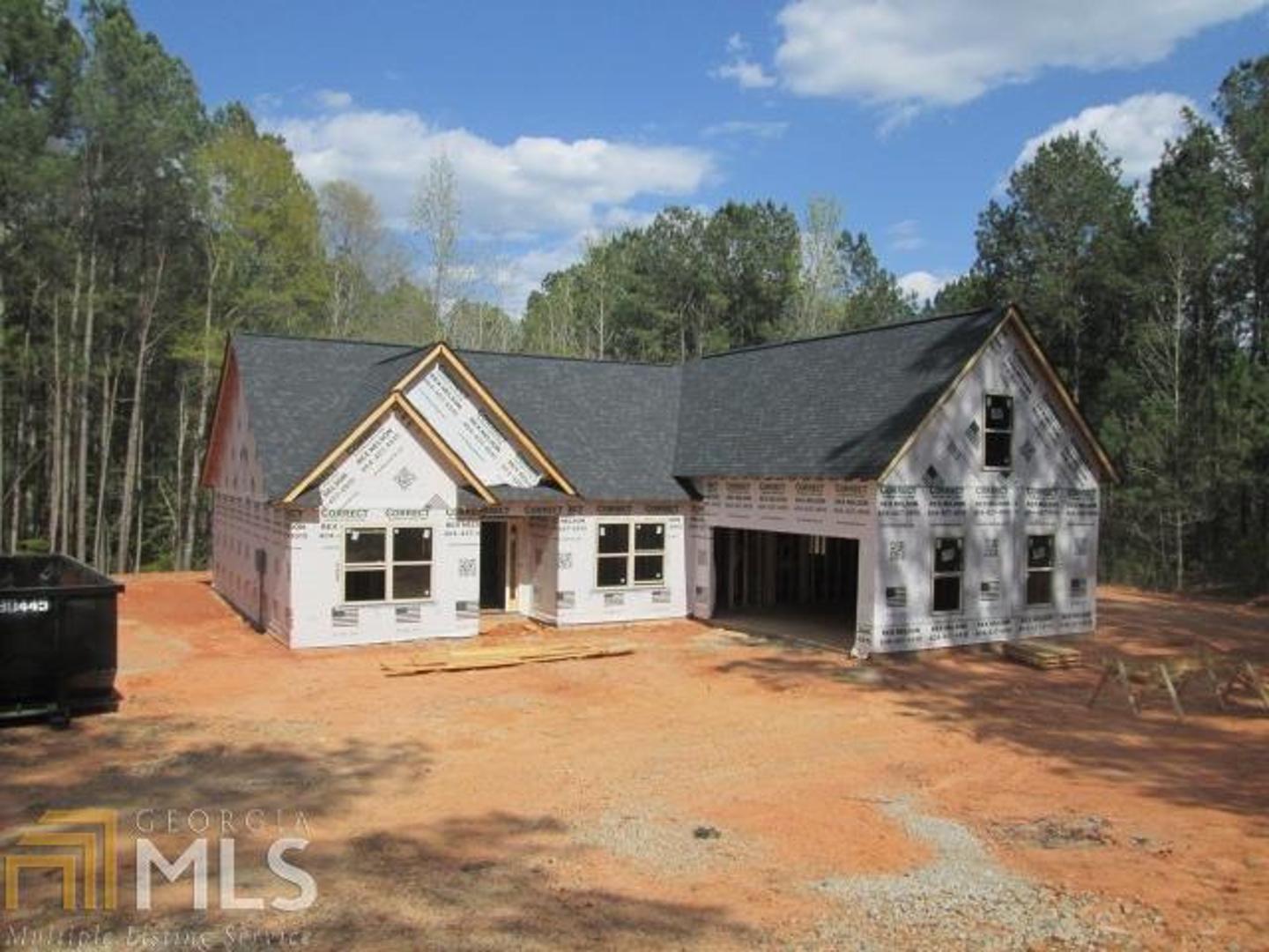 0 Steele Road Milner, GA 30257 - Photo 1 of 1 a front view of a house with a yard and garage
