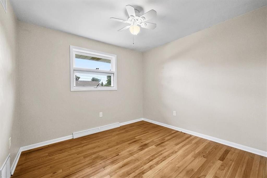 117 Randy Drive Butler, PA 16002 - Photo 10 of 24 wooden floor in an empty room with a window