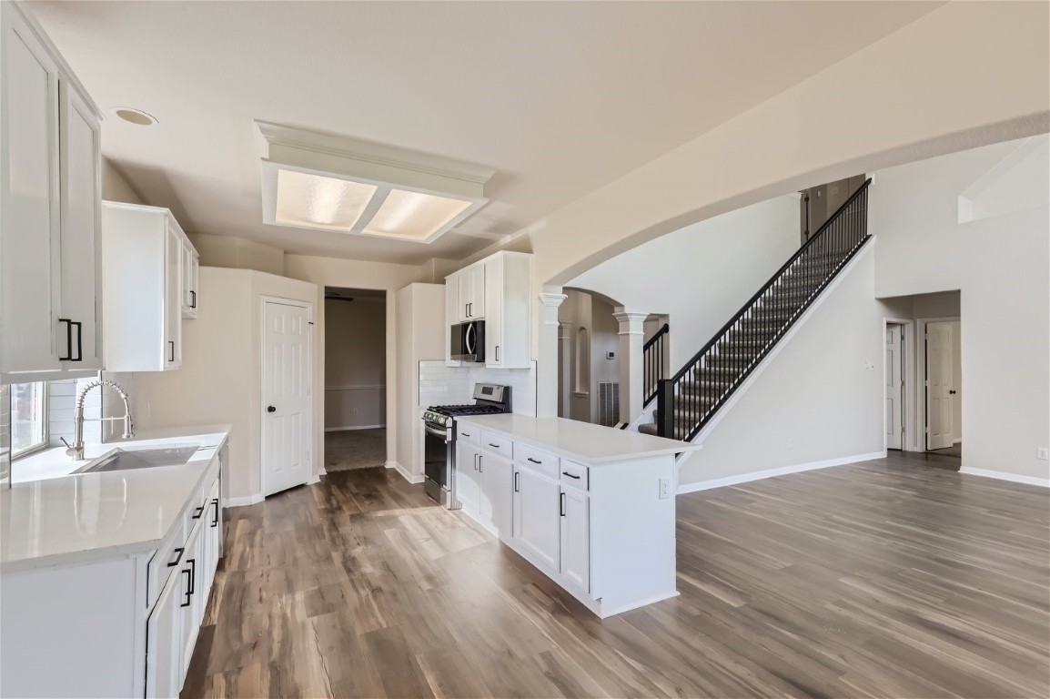 a view of a kitchen cabinets and wooden floor