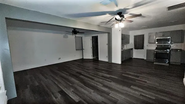 a kitchen with a refrigerator stove and sink