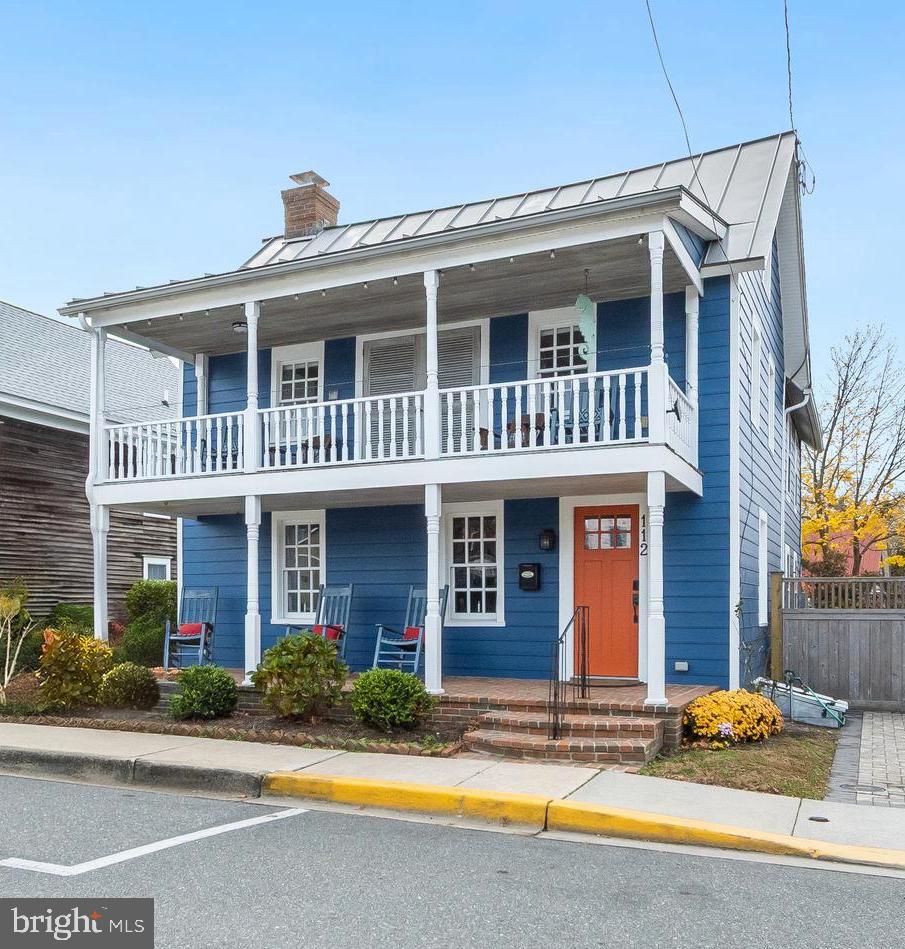 a front view of a house with entertaining space