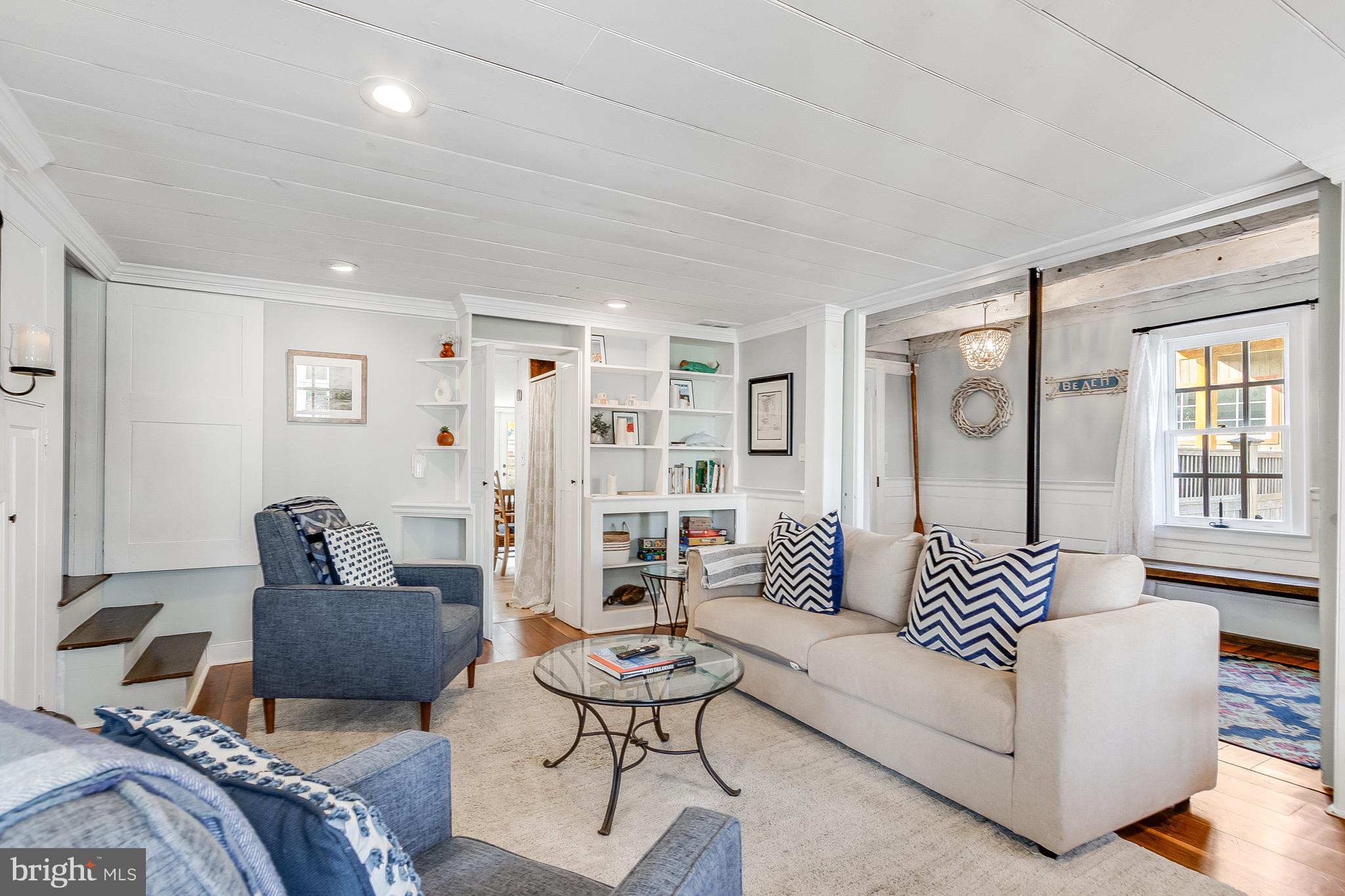 112 West 3rd Street Lewes, DE 19958 - Photo 14 of 73 a living room with furniture and a large window