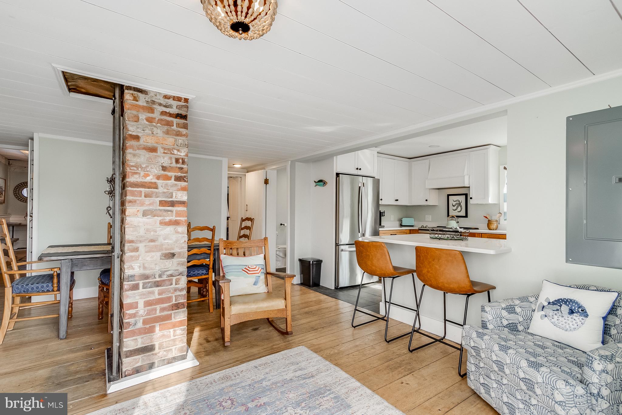 112 West 3rd Street Lewes, DE 19958 - Photo 18 of 73 a living room with furniture a rug and white walls