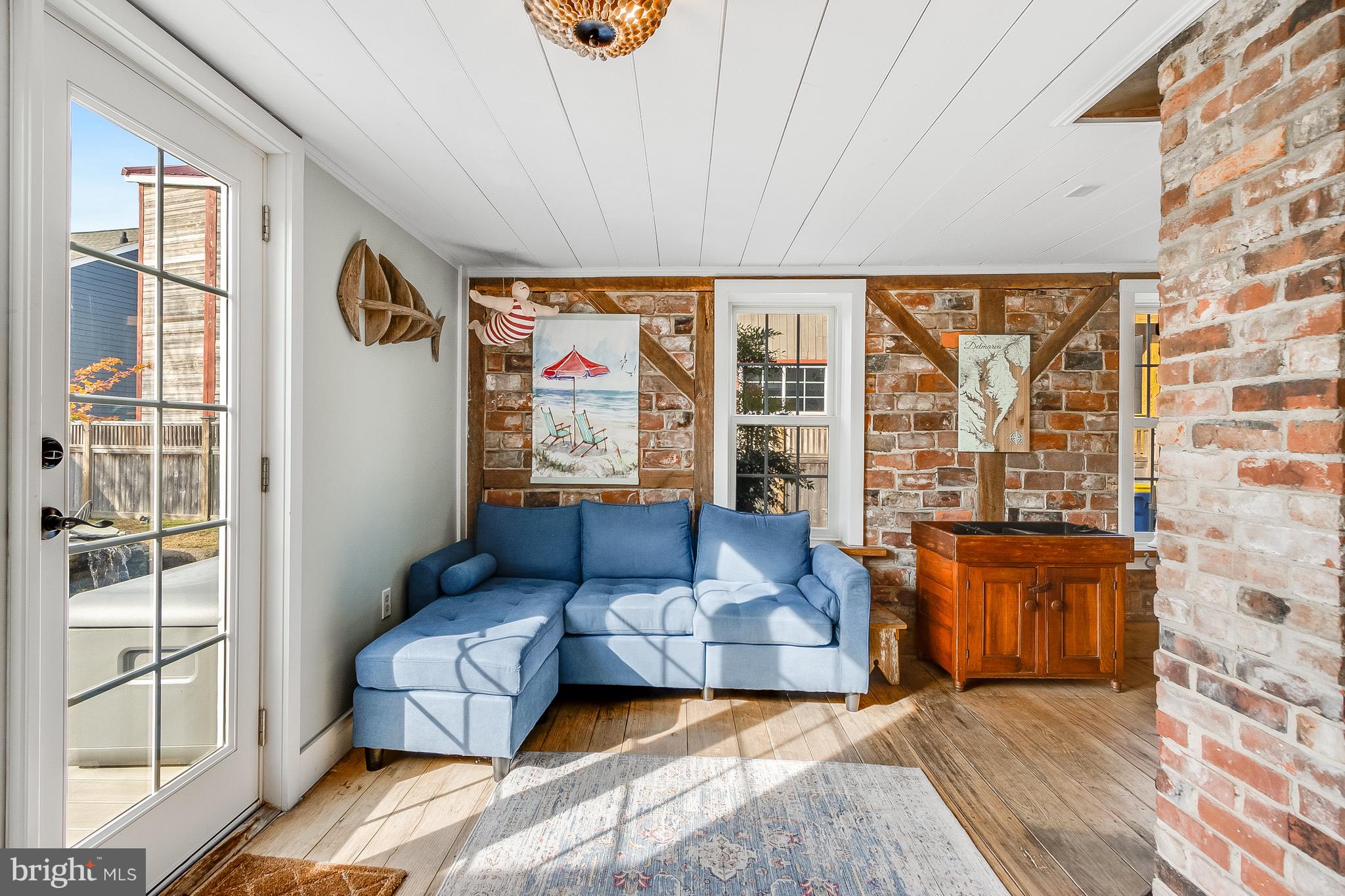 112 West 3rd Street Lewes, DE 19958 - Photo 20 of 73 a living room with furniture and a large window