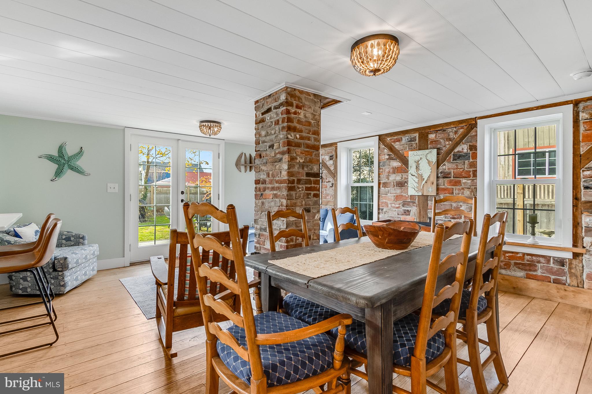 112 West 3rd Street Lewes, DE 19958 - Photo 24 of 73 a view of a dining room with furniture window and wooden floor