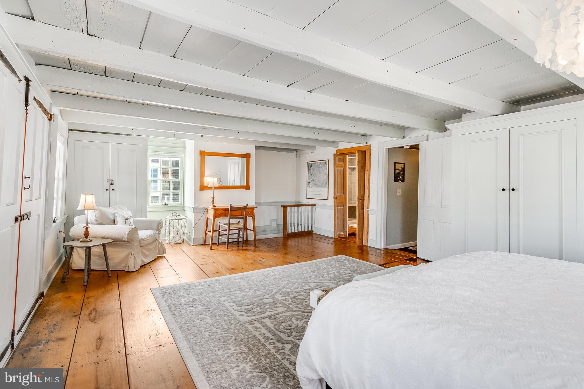 112 West 3rd Street Lewes, DE 19958 - Photo 33 of 73 a bed room with a bed and wooden floor