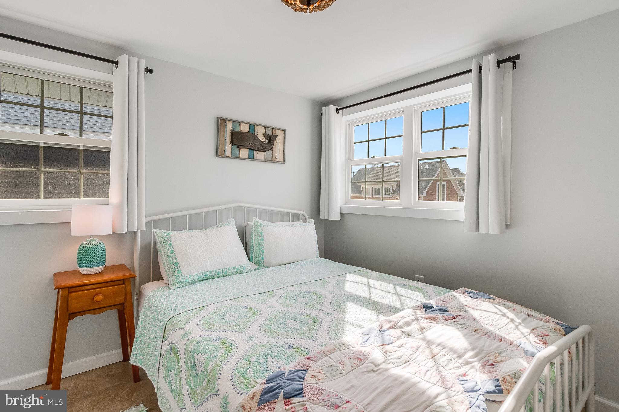112 West 3rd Street Lewes, DE 19958 - Photo 49 of 73 a bedroom with a bed and window