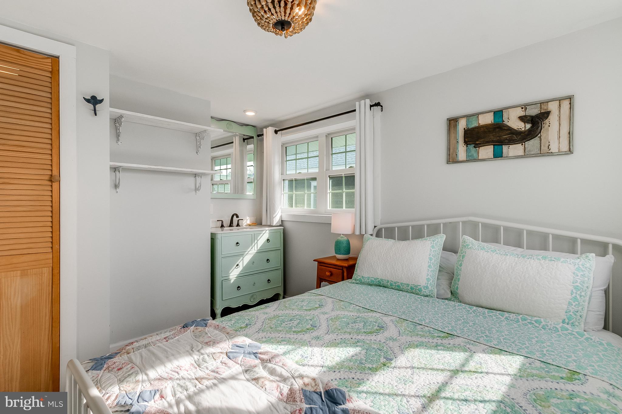 112 West 3rd Street Lewes, DE 19958 - Photo 50 of 73 a bedroom with a bed and a window