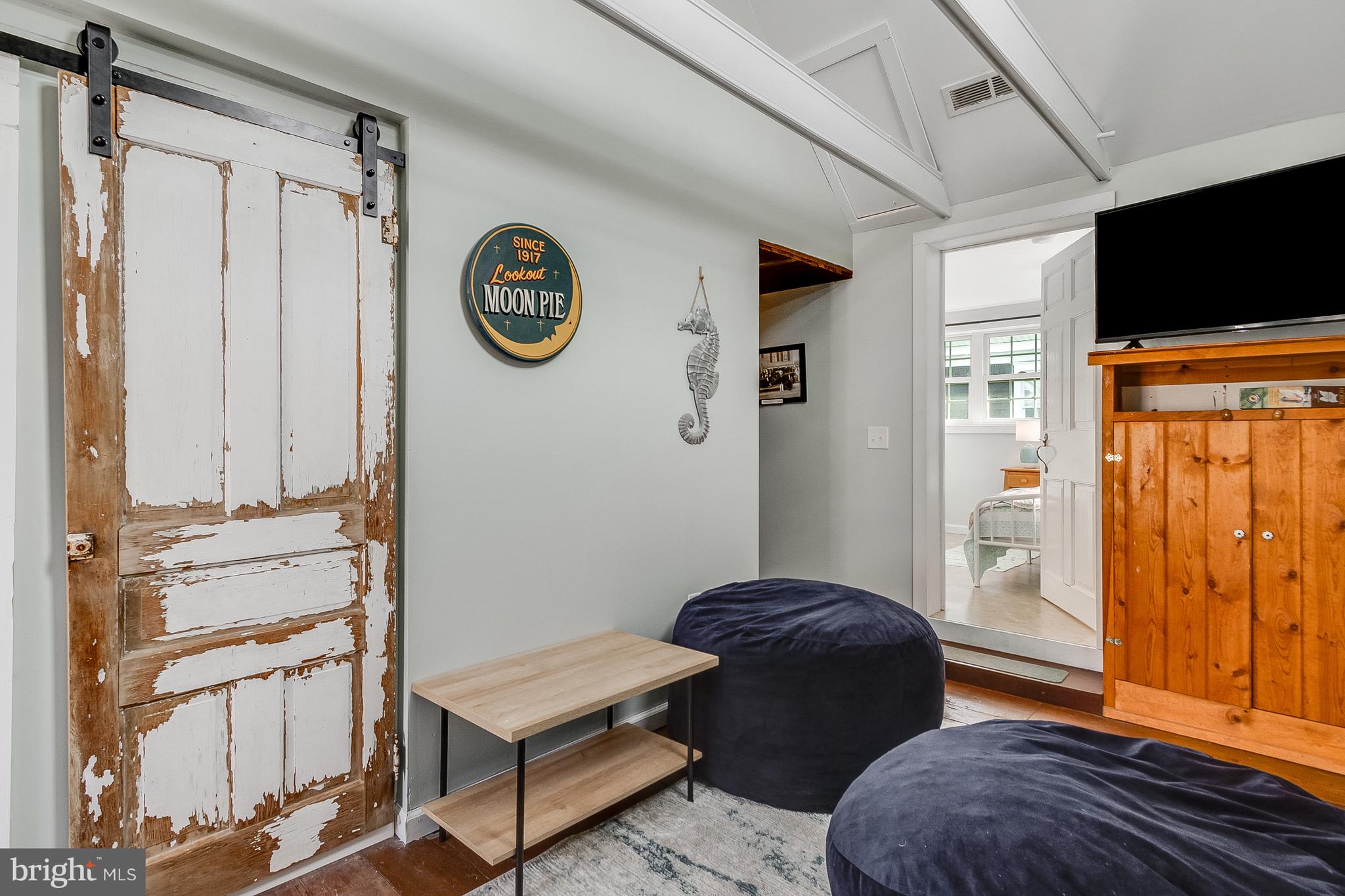 112 West 3rd Street Lewes, DE 19958 - Photo 54 of 73 a living room with furniture and a flat screen tv