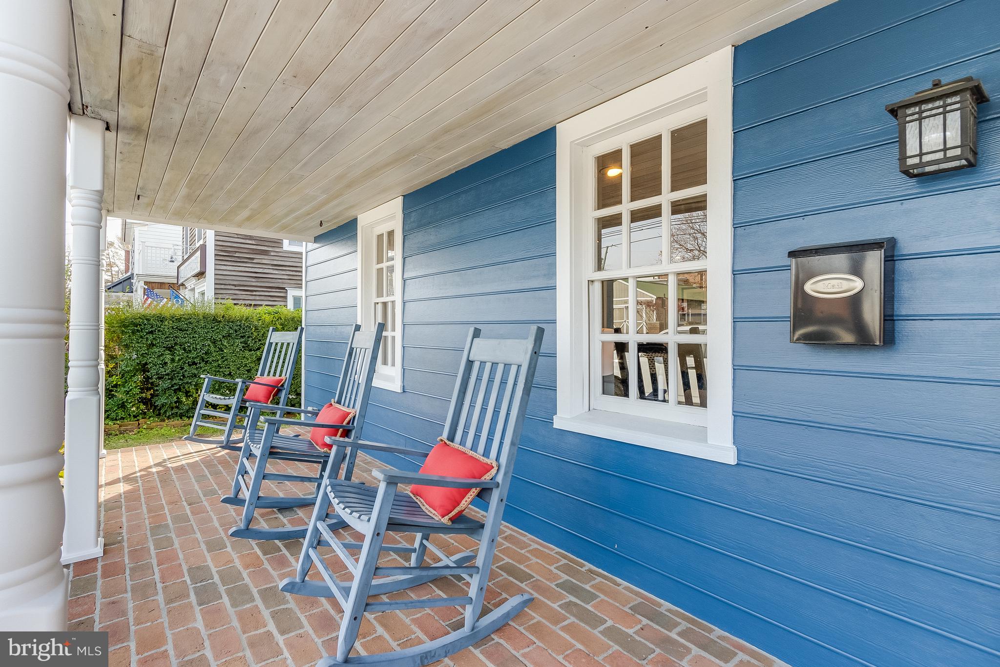 112 West 3rd Street Lewes, DE 19958 - Photo 6 of 73 a view of a patio with table and chairs and wooden floor