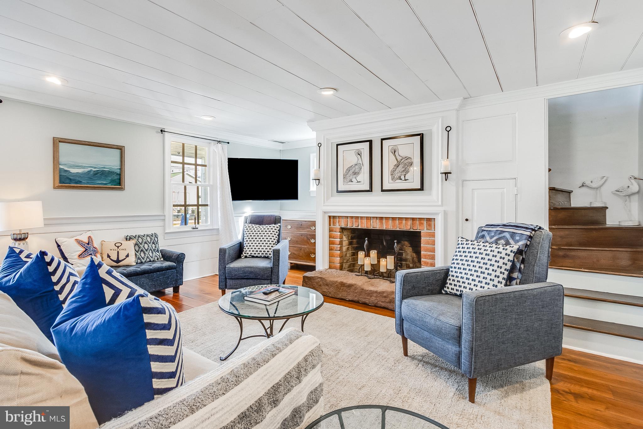 112 West 3rd Street Lewes, DE 19958 - Photo 10 of 73 a living room with furniture fireplace and a flat screen tv