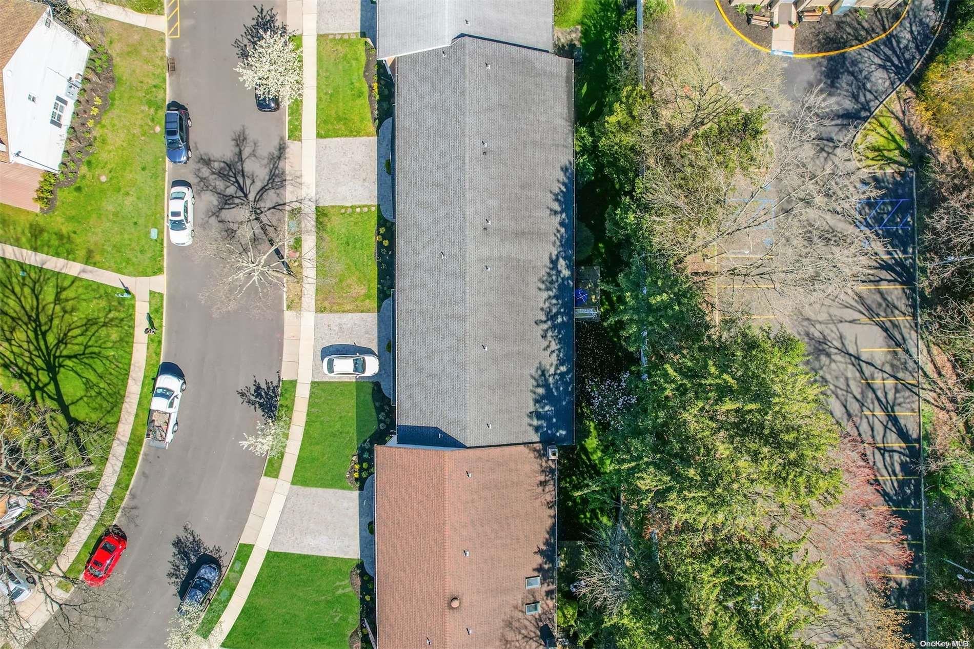 37 Santa Barbara Drive, Unit 37 Plainview, NY 11803 - Photo 2 of 32 an aerial view of a house with a yard